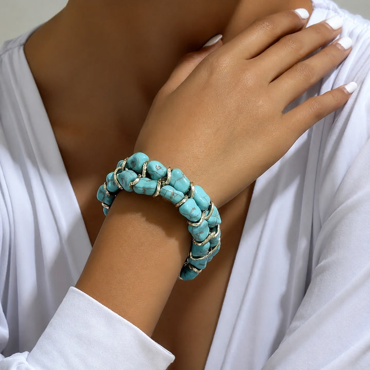 Bracelet en or tressé avec pierre turquoise