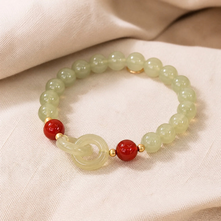 Bracelet en Perles de Jade Infini avec Charme