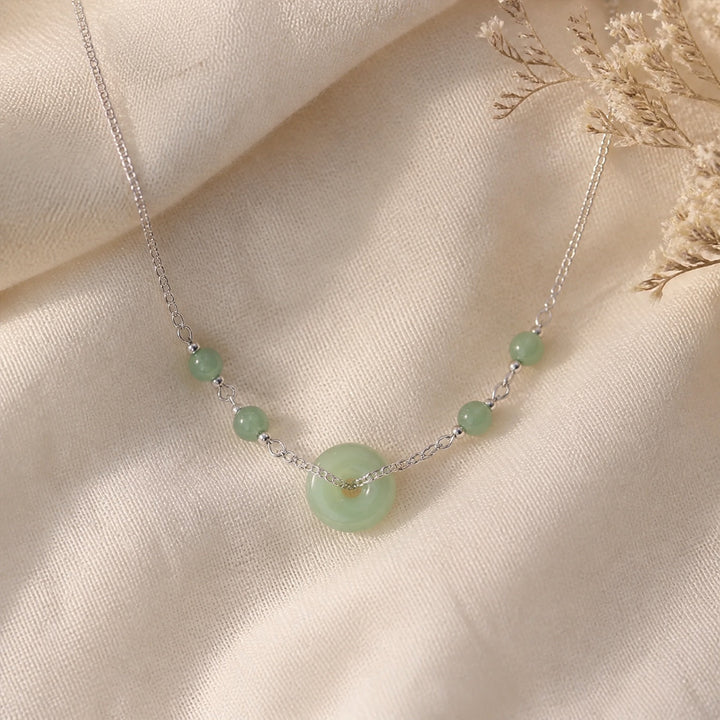 Collier en jade avec pendentif donut en perles