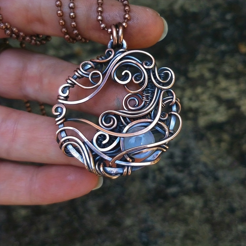 Pendentif circulaire en pierre de lune enroulé de fil