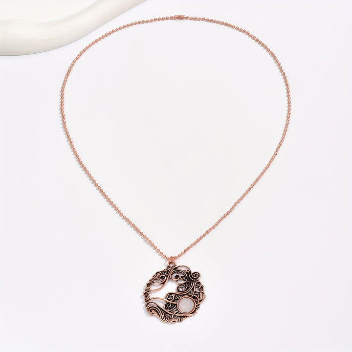 Pendentif circulaire en pierre de lune enroulé de fil