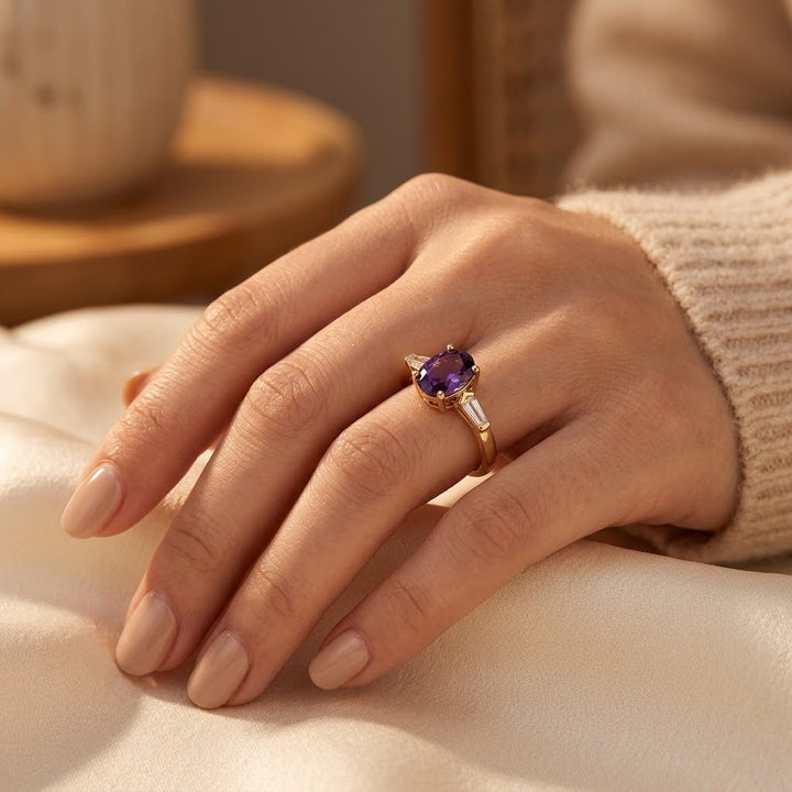 Gold ring with three amethyst stones