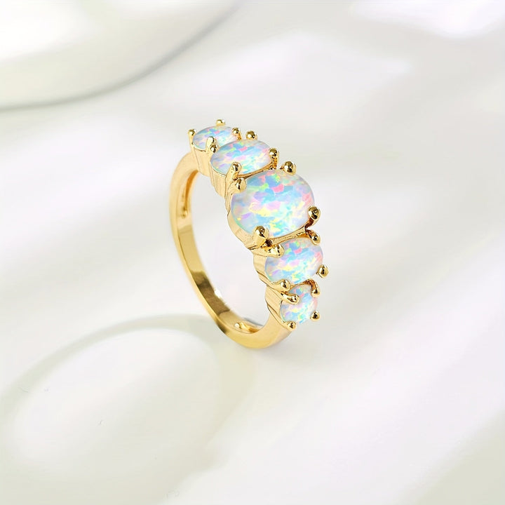 Bague en or ornée de cinq opales