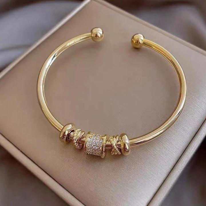 Bracelet réglable avec charms dorés