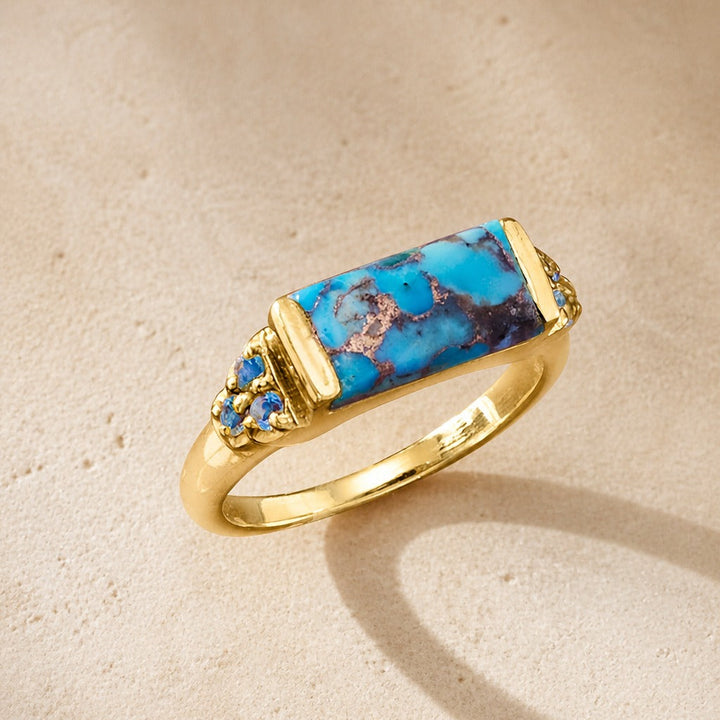 Bague en or avec incrustation de cuivre et de turquoise