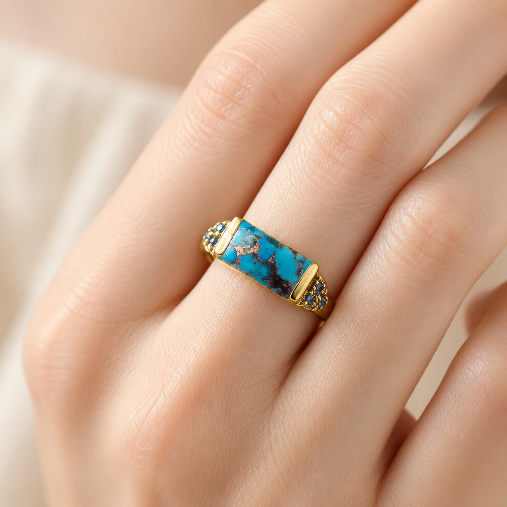 Bague en or avec incrustation de cuivre et de turquoise