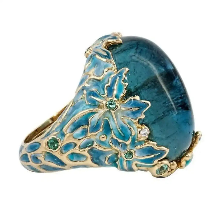 Bague Élégante en Fleur Dorée avec Pierre Bleue