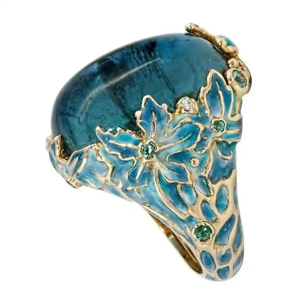Bague Élégante en Fleur Dorée avec Pierre Bleue