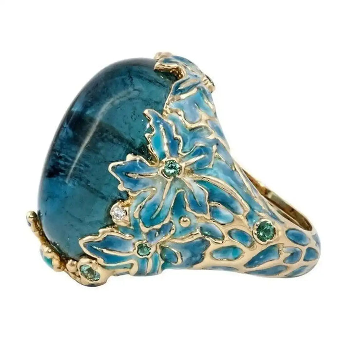 Bague Élégante en Fleur Dorée avec Pierre Bleue