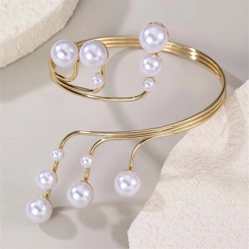 Bracelet jonc vintage en or et perles suspendues